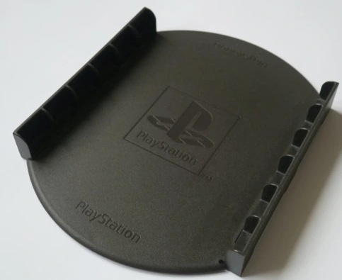картинка Оригинальная подставка для дисков Sony PS One. Купить Оригинальная подставка для дисков Sony PS One в магазине 66game.ru